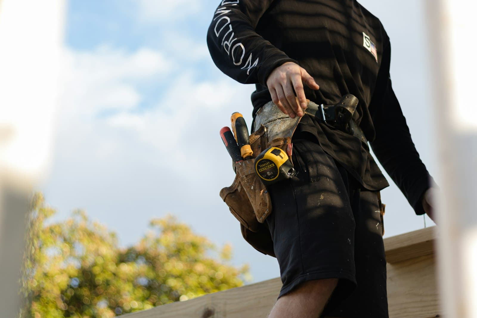 Carpenter wearing a leather tool belt