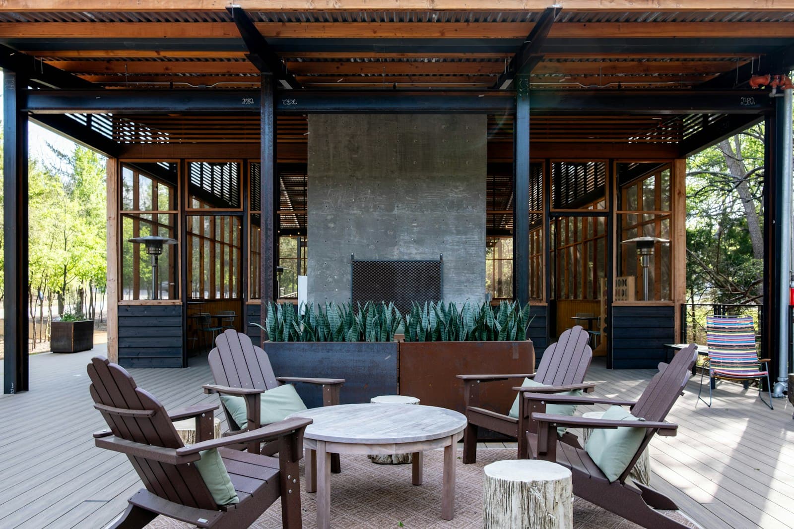 Outdoor living area with a stone fireplace